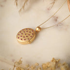 Adam Taweez - Gold featuring ruby detailing