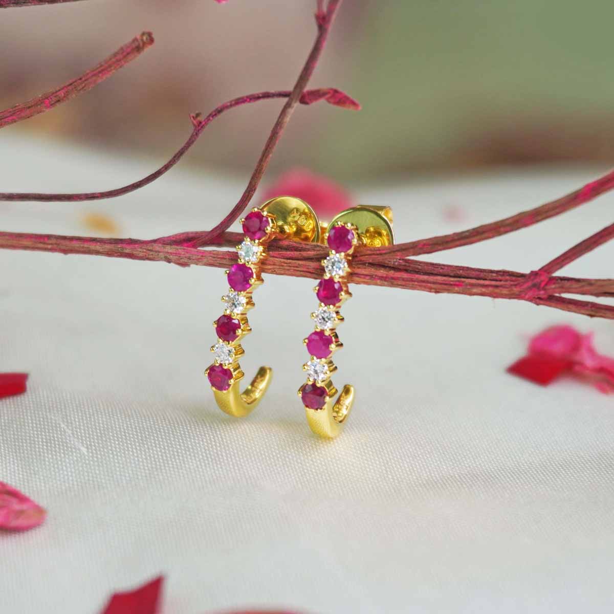 Side view of Aasma Ruby Earrings showcasing the ruby hoop design